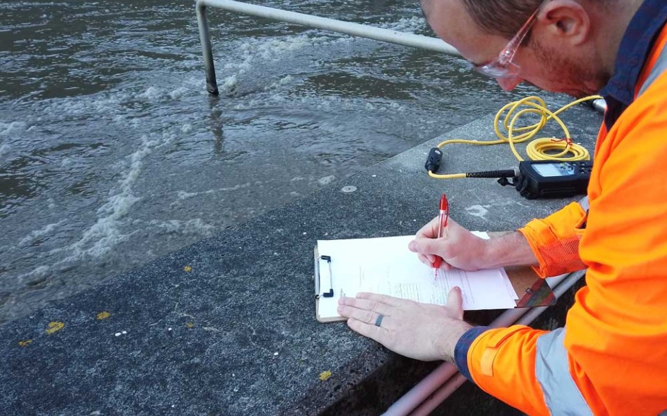 Wastewater Process Engineer Onsite Taking Measurements