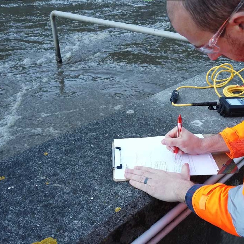 Wastewater Process Engineer Onsite Taking Measurements